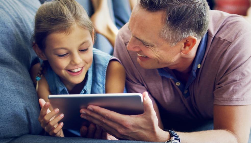 picture of a father and daughter on a device