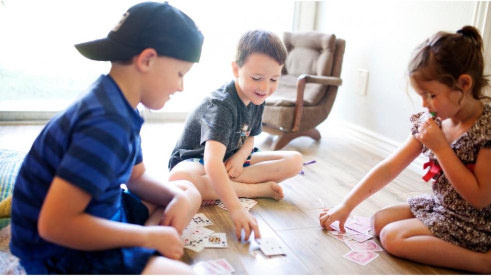 picture of children playing a card game
