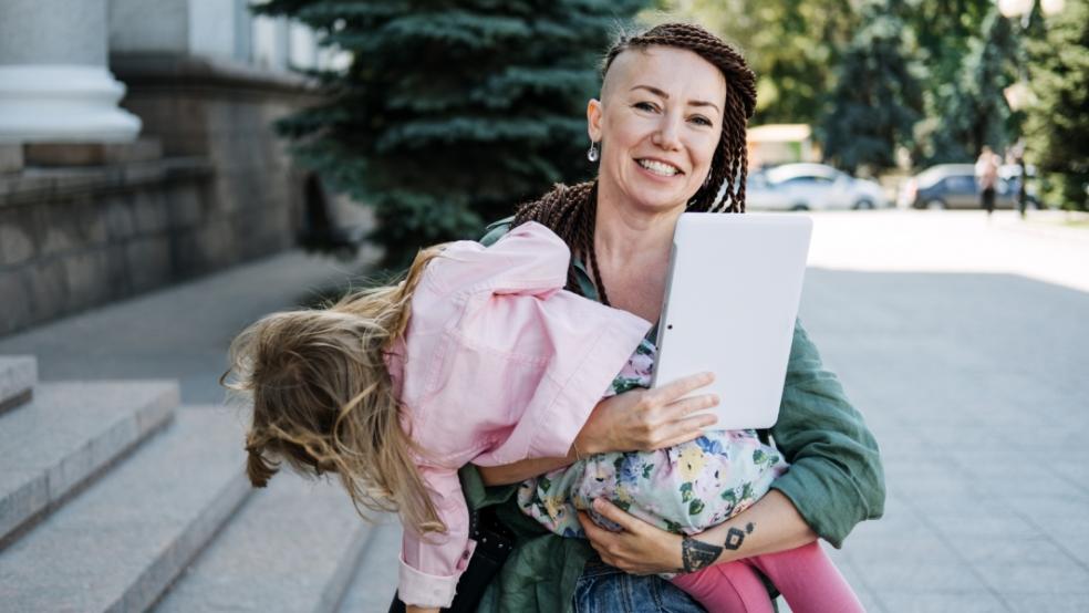 picture of a mum carrying a child