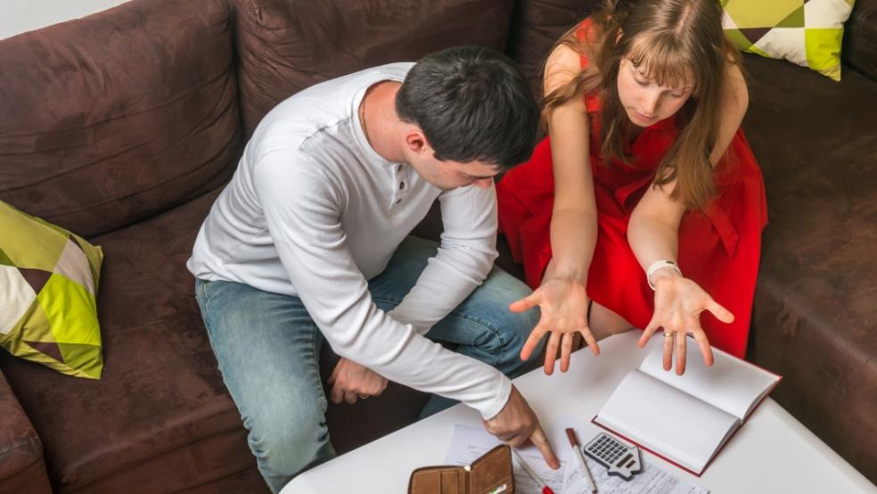 picture of a couple looking at their family budget