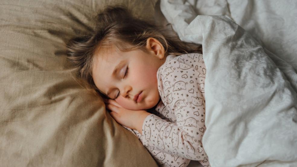 picture of child asleep in bed