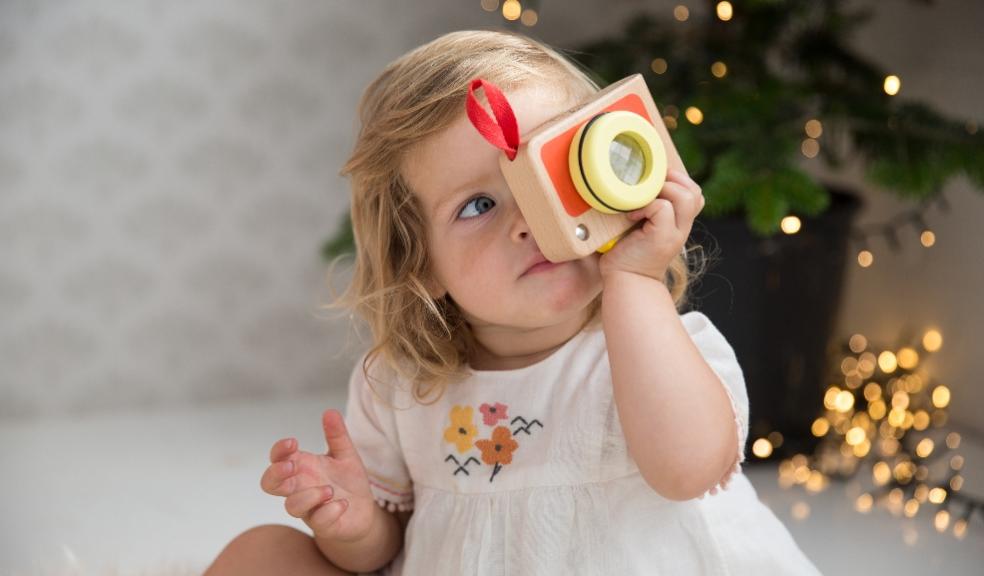 picture of a child playing with a My First Camera wooden toy
