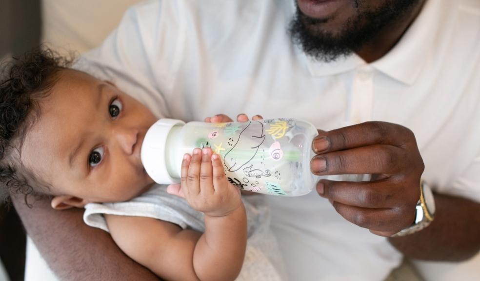 picture of a baby with a Dr Browns animal themed bottles