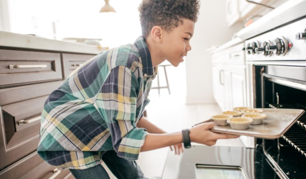 picture of a child building confidence and independence through learning to cook