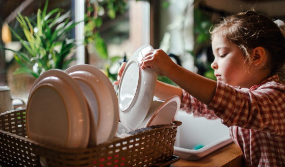 a child learning independence through household chores like doing the dishes picture of a child learning independence through household chores like doing the dishes