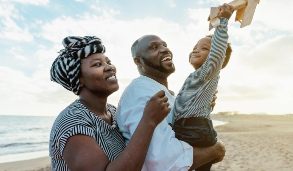 picture of a happy African family on a beach
