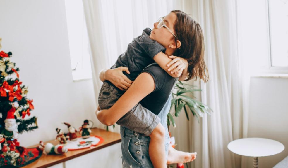 picture of a mum hugging her child helping them to manage their emotions