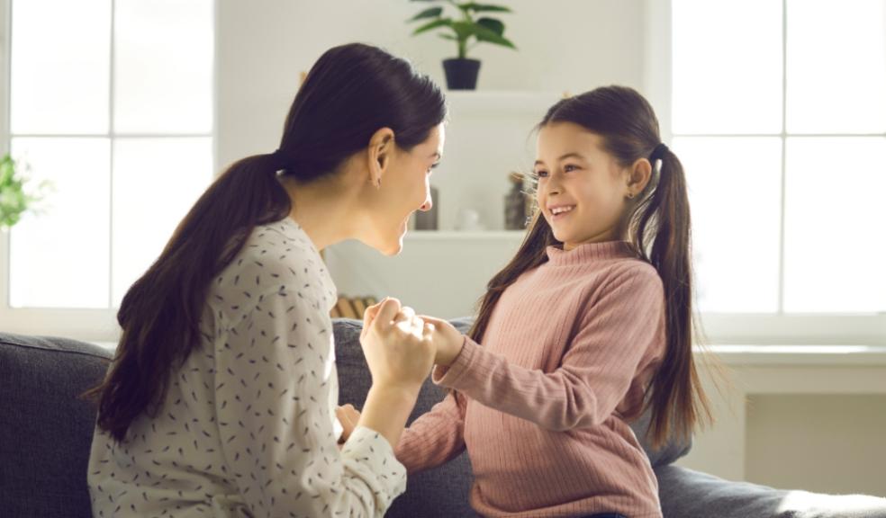 a mum looking at her happy child and letting her child talk picture of a mum looking at her happy child and letting her child talk