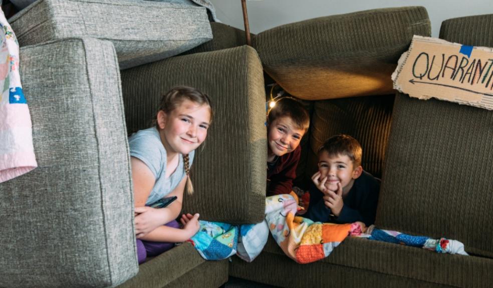 children building a sofa fort at home when not having screen time picture of children building a sofa fort at home when not having screen time