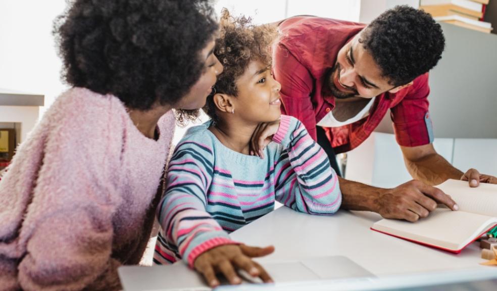 picture of loving parents supporting their child with learning
