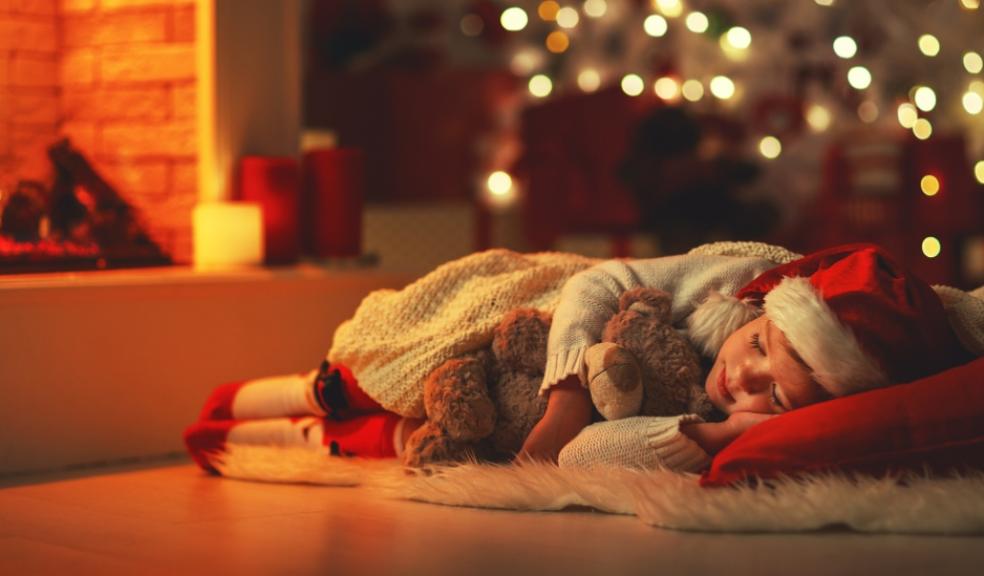 picture of a child asleep at Christmas