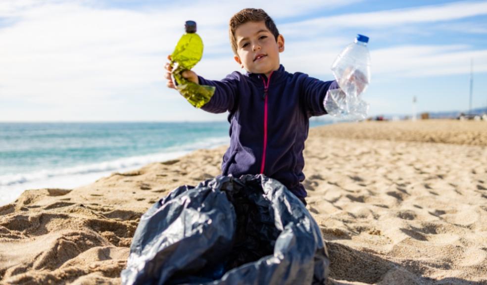picture of a child doing a beach clean