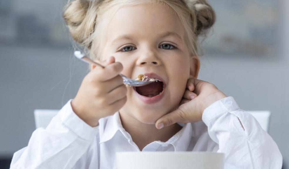 picture of a child eating breakfast