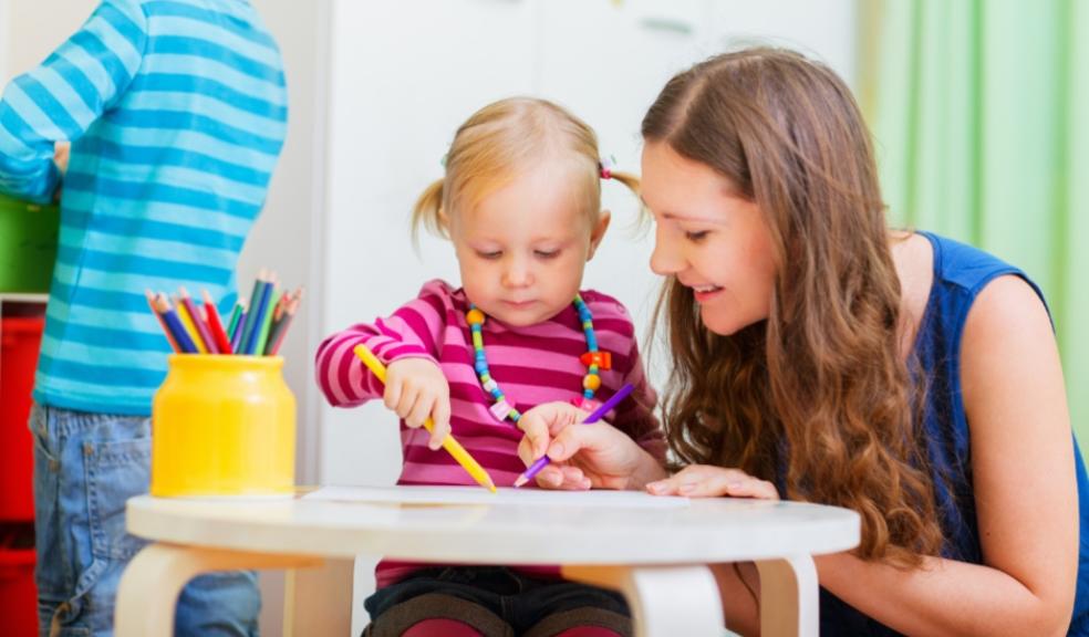picture of a child and nursery worker in a childcare setting