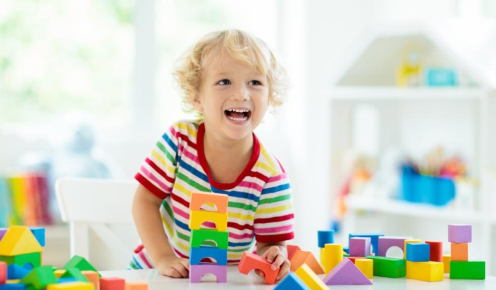 picture of child playing with colourful blocks