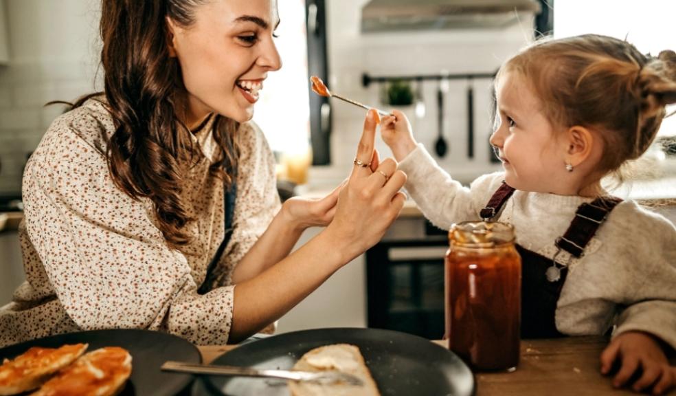 picture of a child spoon feeding parent