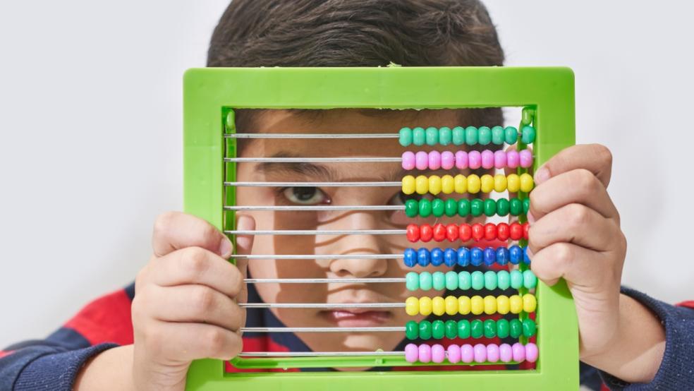 picture of a child with an abacus