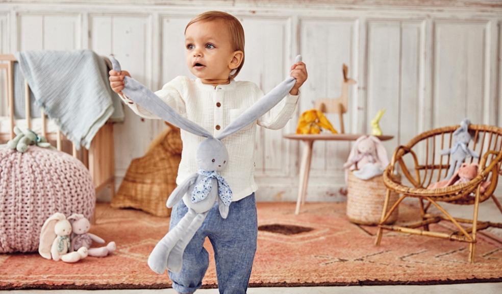 picture of a child with kaloo soft baby toy