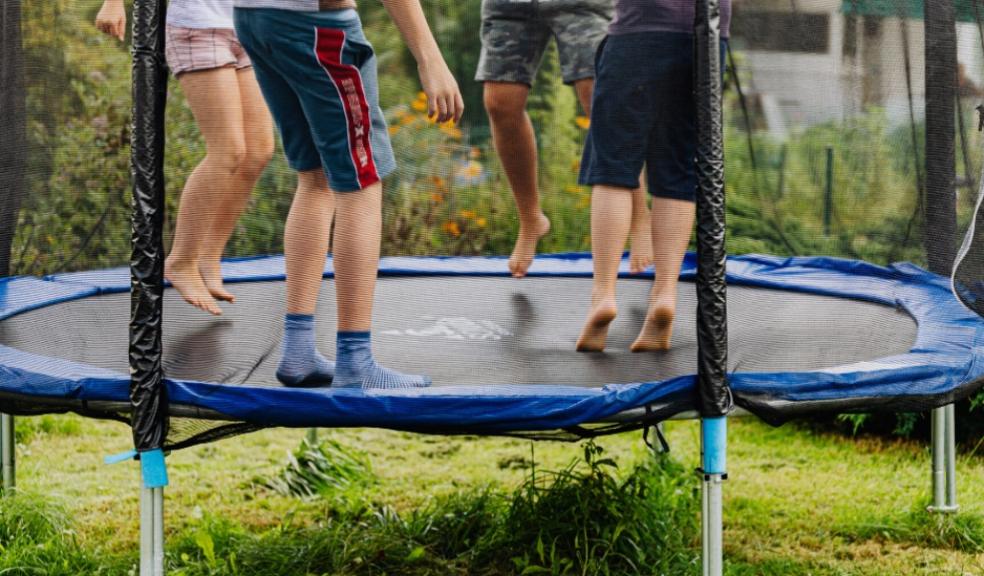 children bouncing on a trampoline outside picture of children bouncing on a trampoline outside