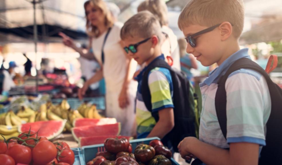 picture of children buying locally produced food