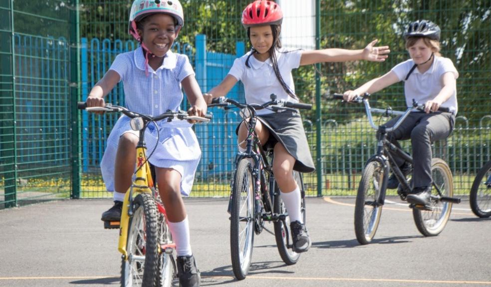picture of children learning to cycle with bikeabilty