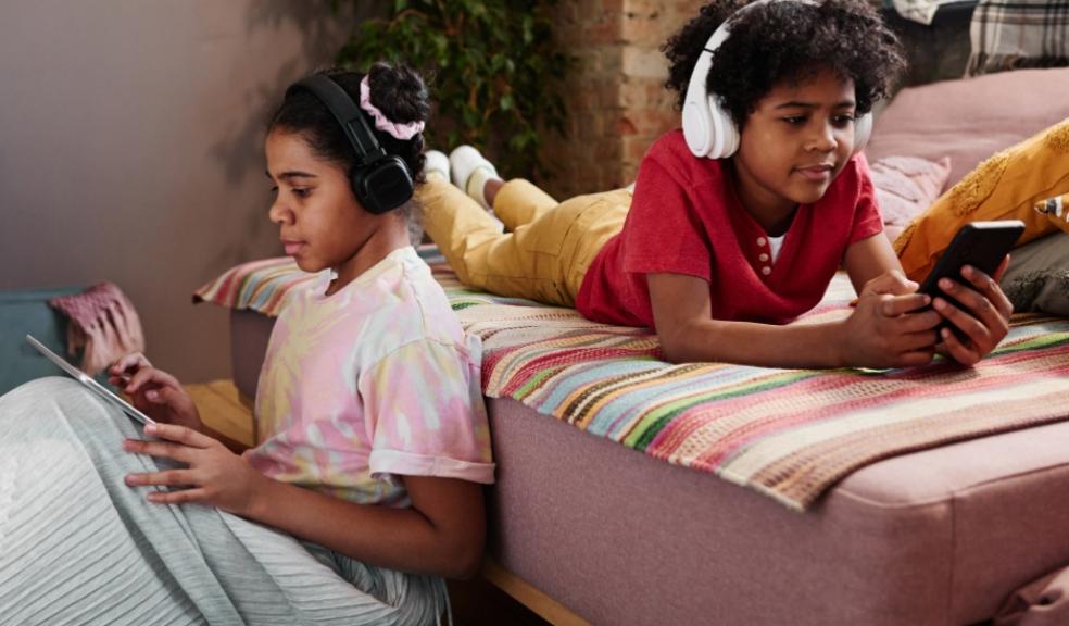 picture of children on devices