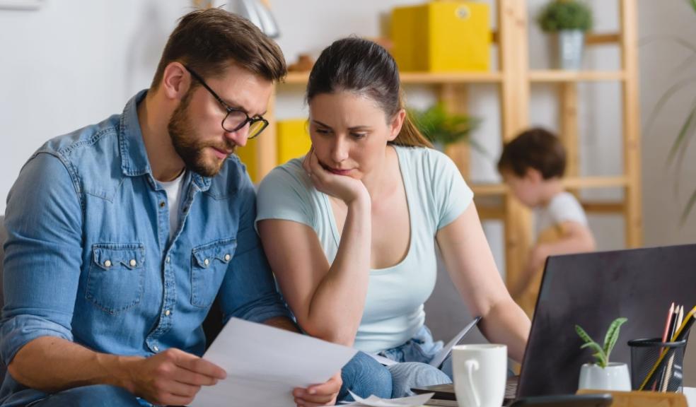 picture of couple looking at bills