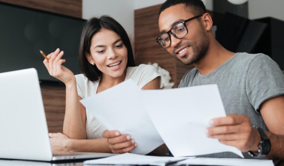 picture of a couple looking at finances
