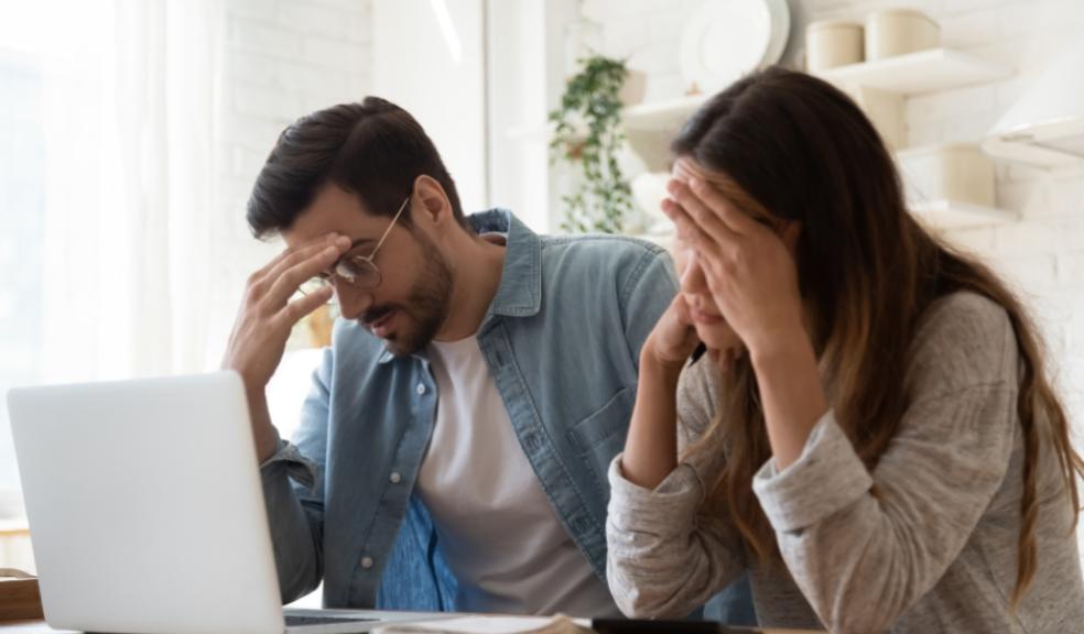picture of couple looking at household bills