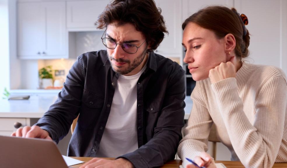 picture of a couple looking at household bills