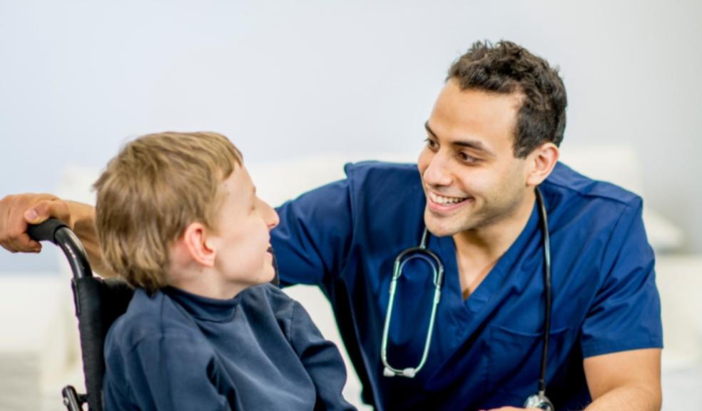 picture of a disabled child with a doctor