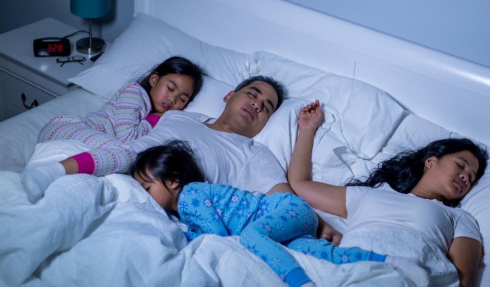 picture of a family co sleeping