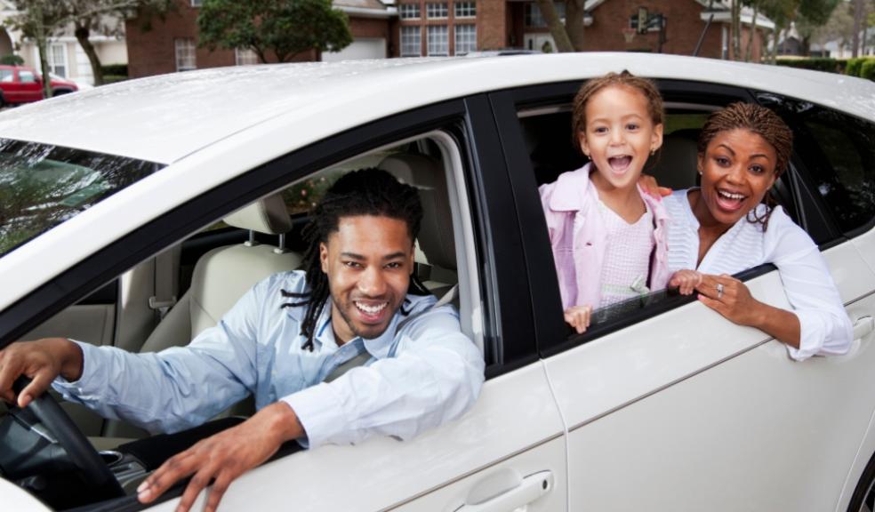 picture of a family in a car