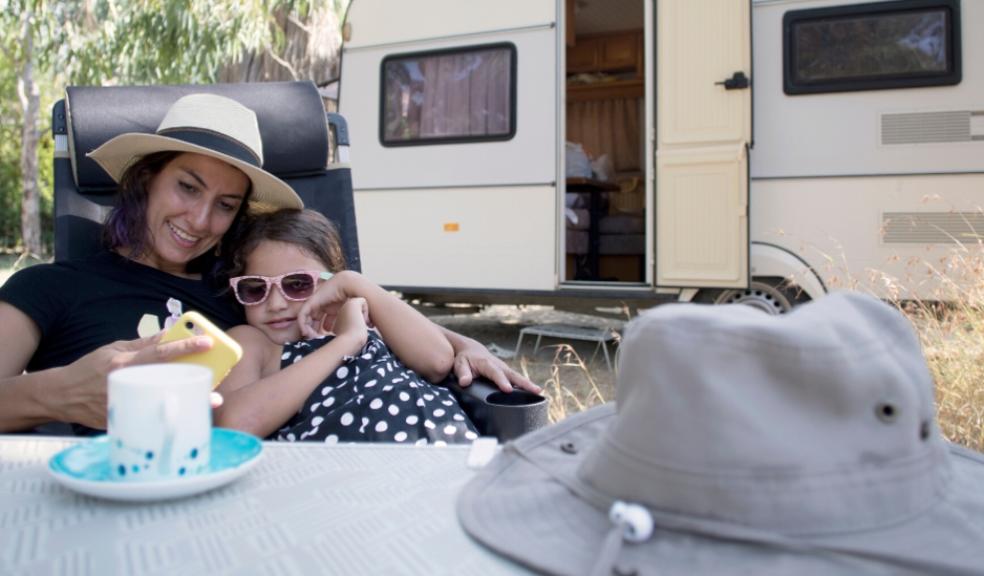 picture of a family outside a caravan