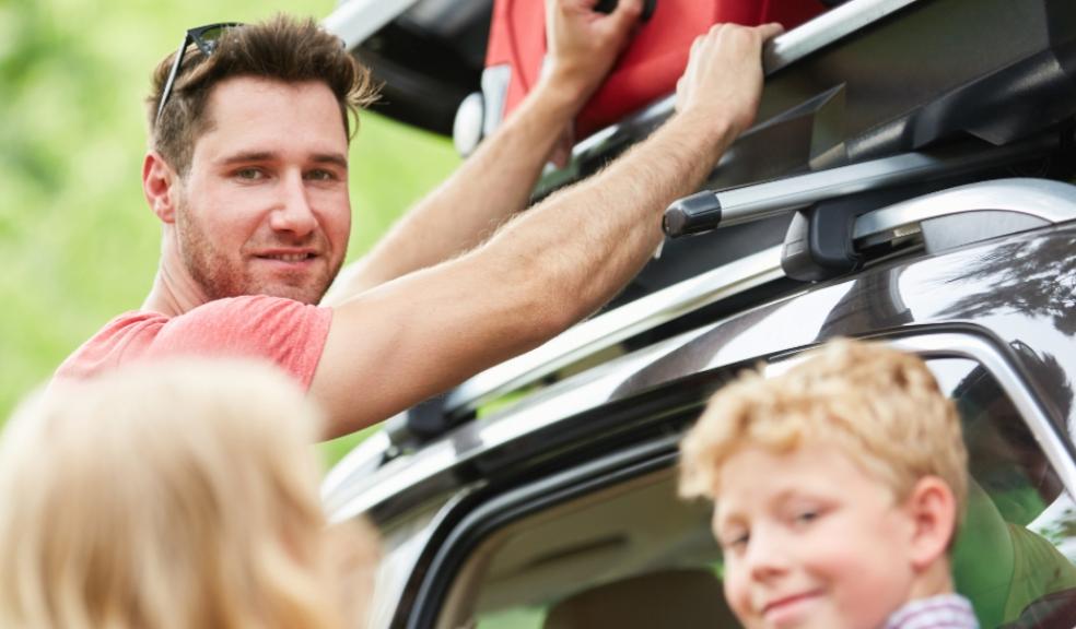 picture of family packing car for holiday