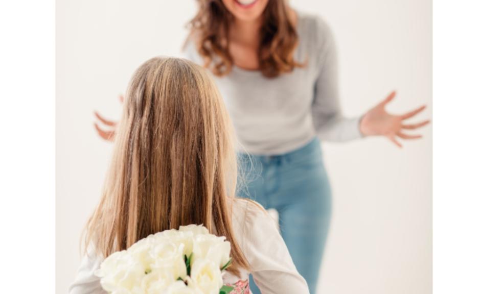 picture of girl giving her mum flowers