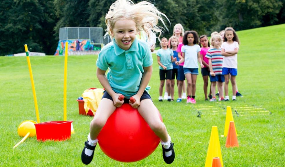 picture of a girl playing in school field