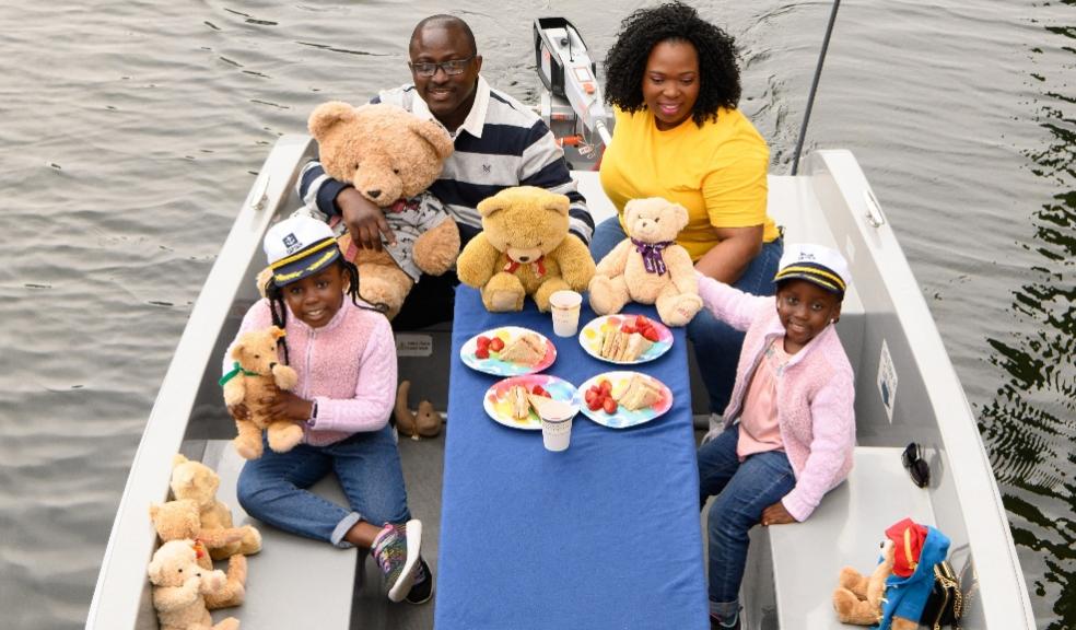 picture of a family on a boat with teddy bears