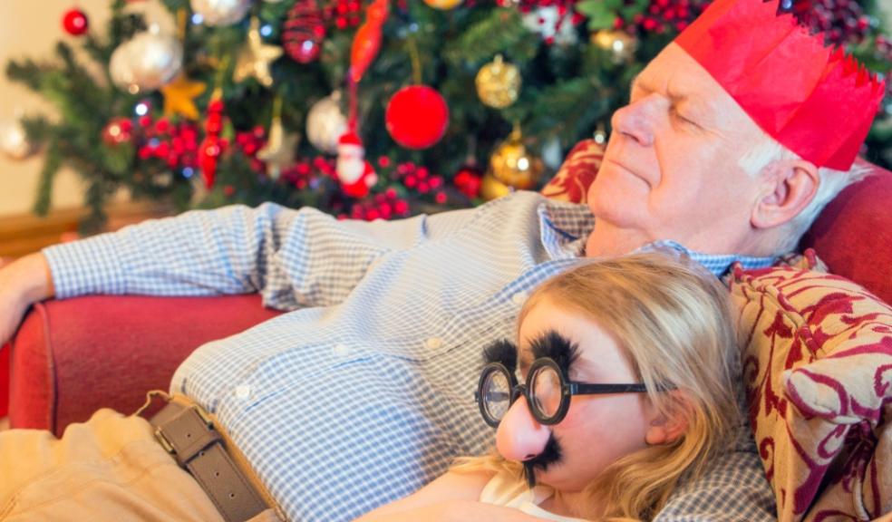 picture of a grandad and granddaughter asleep at Christmas
