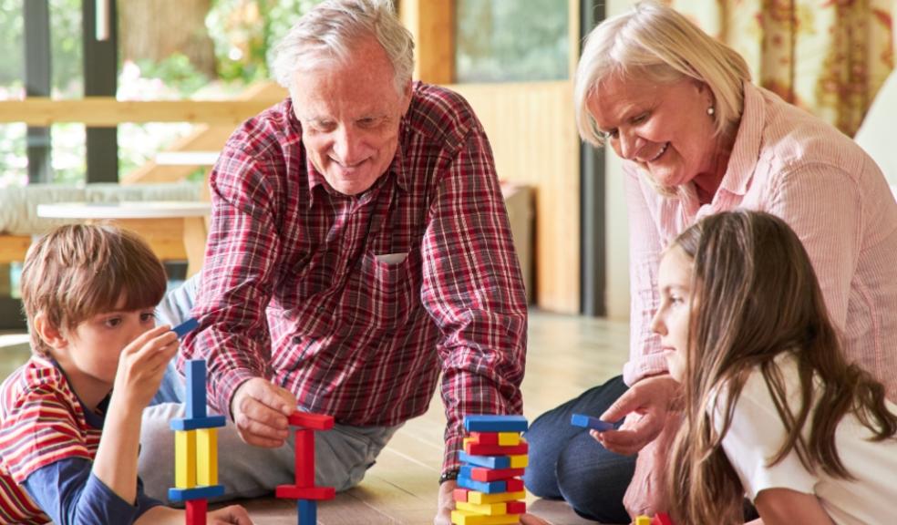 picture of grandparents playing with grandchildren