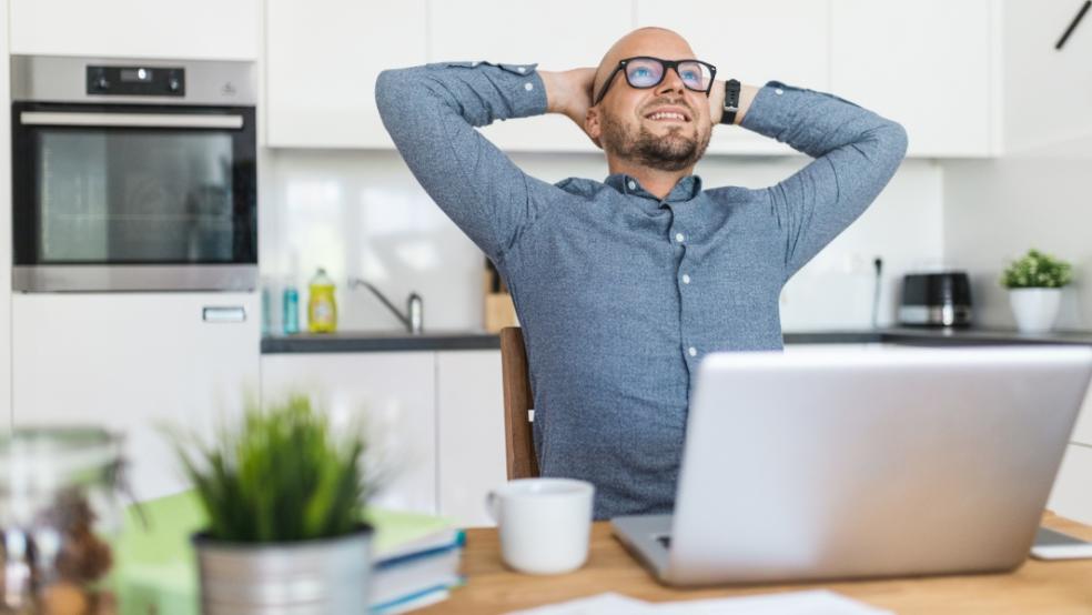 picture of a happy man working from home