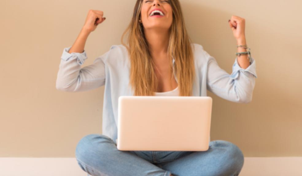 picture of a happy woman with a laptop