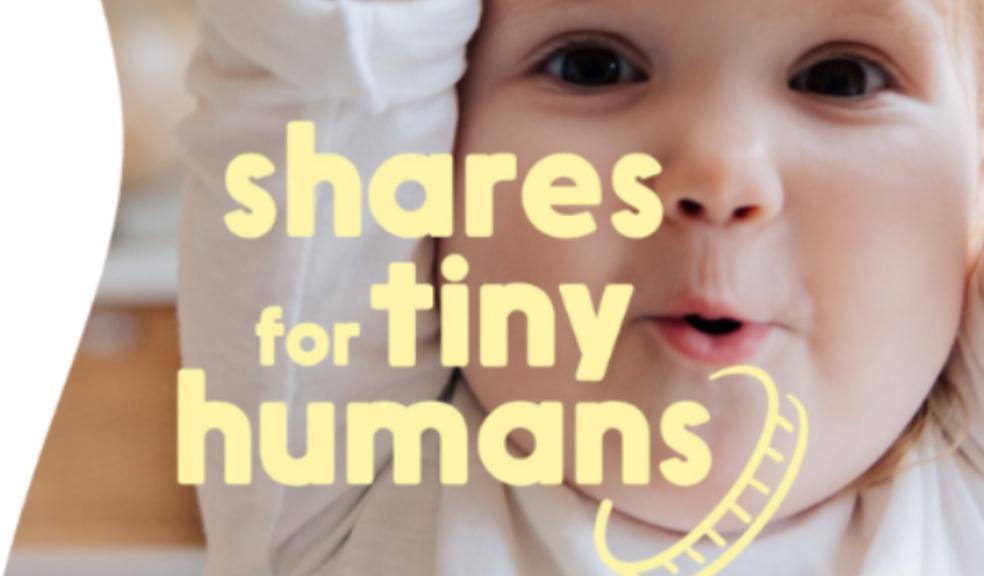 picture of a happy child with shares for tiny humans written on top