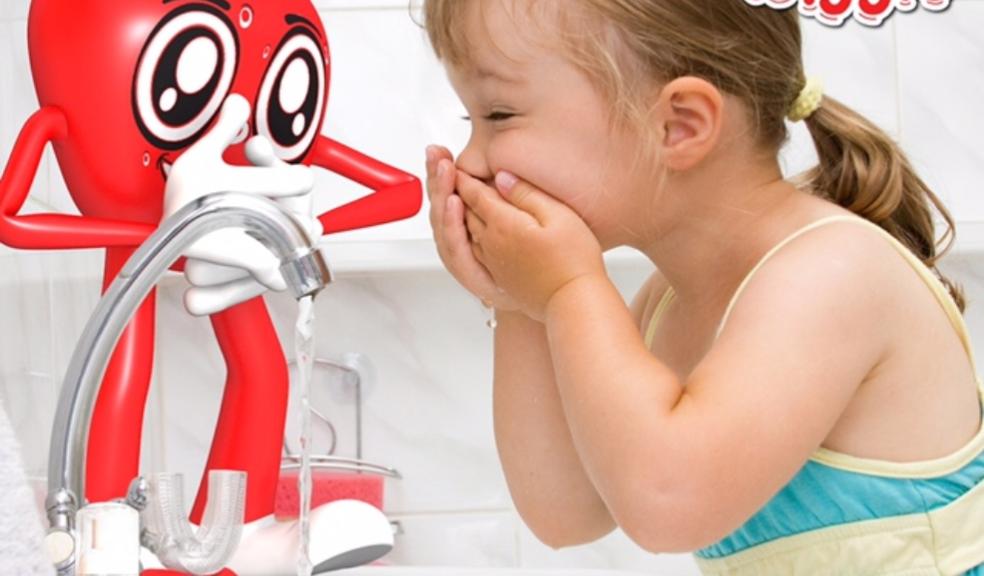 picture of next generation wiggle toothbrush in a a bathroom with a little girl brushing her teeth