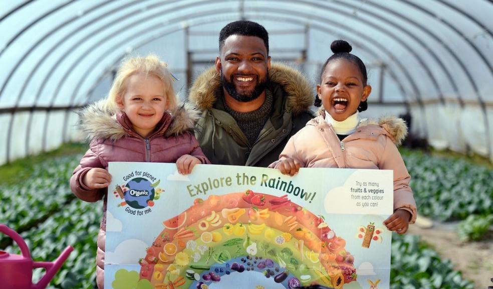 A picture of jb gill and two children promoting healthy eating in for kids