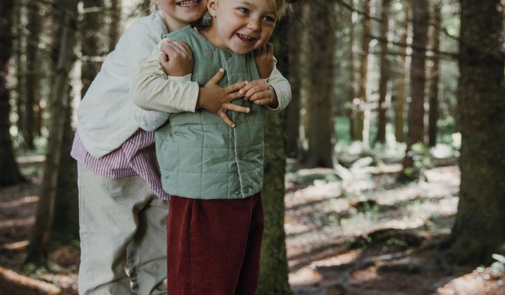 picture of children in the woods wearing pip and henry shoes