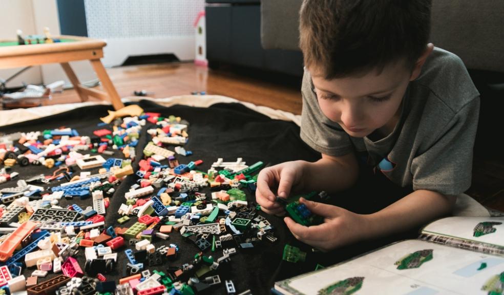 Picture of a child playing with lego blocks