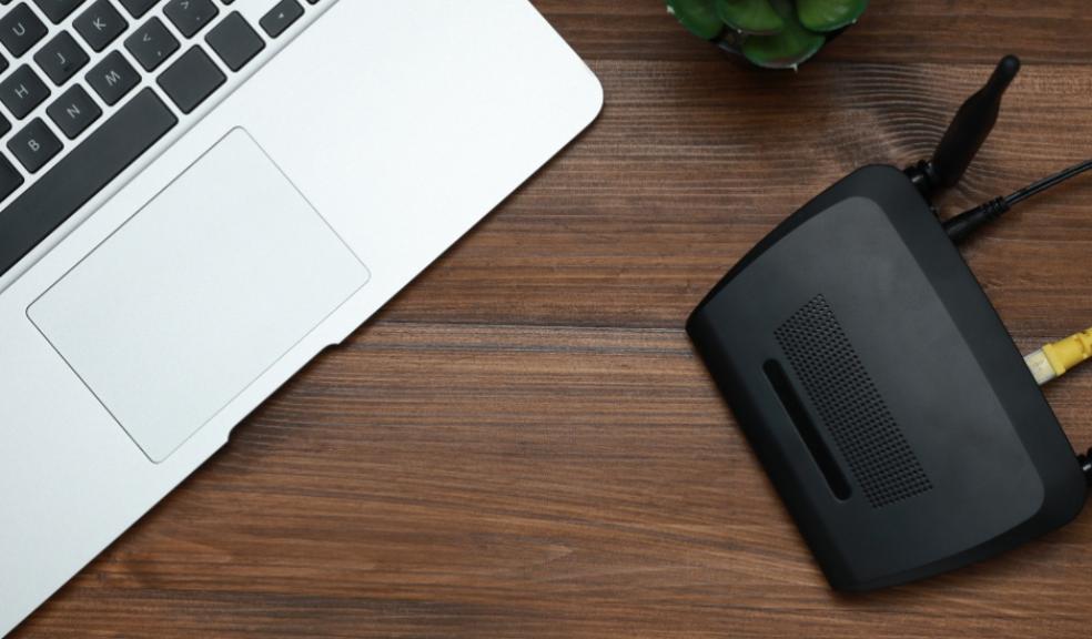 picture of a laptop and broadband router