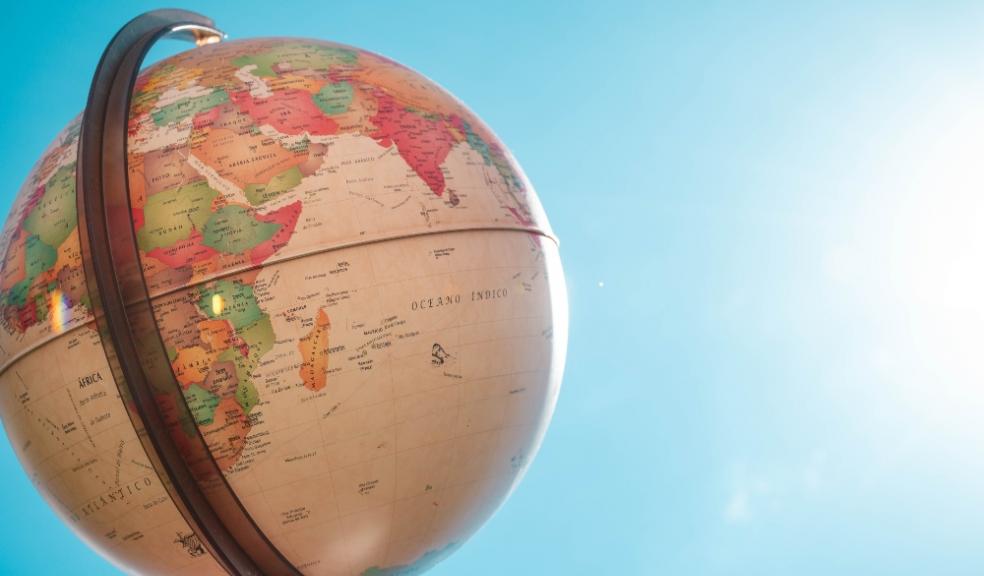 Picture of a world map globe outside in the sunshine