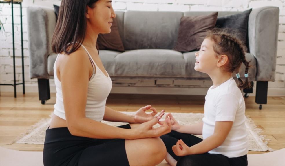 picture of a mother and child meditating